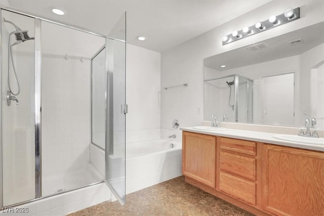 6581 Netherseal Ave, Las Vegas, NV 89139 - full bathroom featuring a shower stall, a garden tub, double vanity, and recessed lighting
