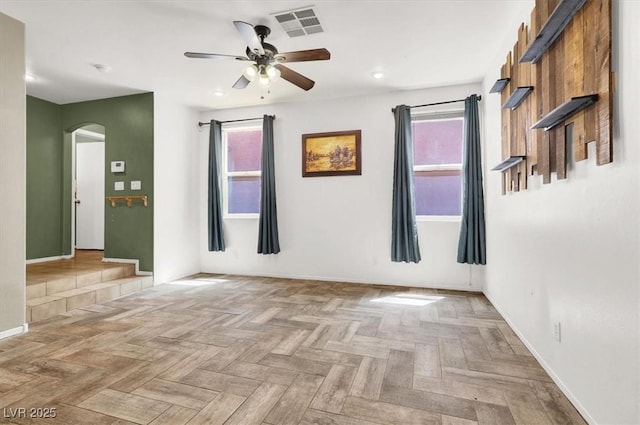 6581 Netherseal Ave, Las Vegas, NV 89139 - empty room featuring arched walkways, a ceiling fan, healthy amount of natural light, baseboards, and recessed lighting
