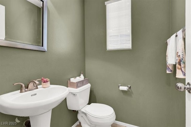 6581 Netherseal Ave, Las Vegas, NV 89139 - bathroom with baseboards, toilet, and a sink