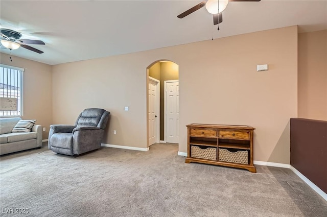 9303 Gilcrease Ave Unit 1002, Las Vegas, NV 89149 - sitting room with ceiling fan, arched walkways, and carpet flooring