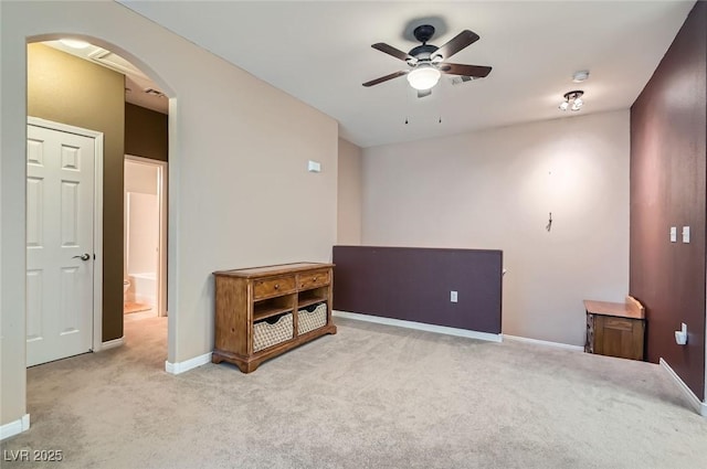 9303 Gilcrease Ave Unit 1002, Las Vegas, NV 89149 - empty room featuring arched walkways, a ceiling fan, carpet, and baseboards