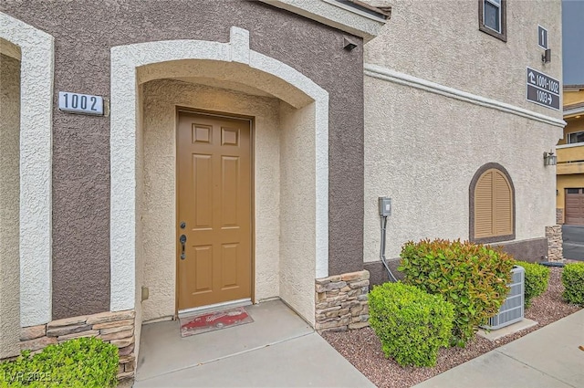 9303 Gilcrease Ave Unit 1002, Las Vegas, NV 89149 - property entrance with stucco siding and stone siding