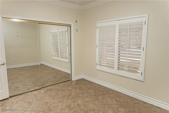 2501 Maddington Dr, Las Vegas, NV 89134 - unfurnished bedroom featuring crown molding, tile patterned flooring, and baseboards