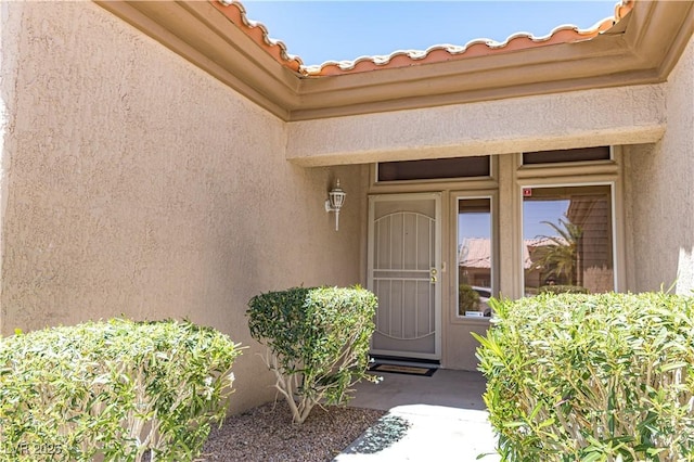2501 Maddington Dr, Las Vegas, NV 89134 - doorway to property featuring stucco siding