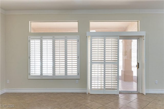 2501 Maddington Dr, Las Vegas, NV 89134 - unfurnished room with baseboards, tile patterned floors, and crown molding