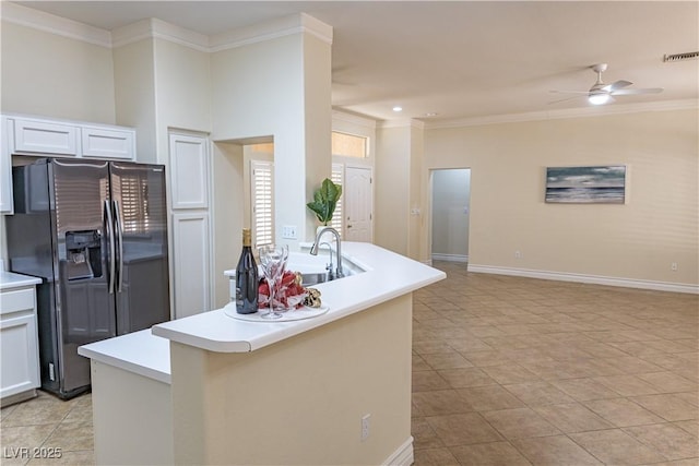 2501 Maddington Dr, Las Vegas, NV 89134 - kitchen featuring stainless steel fridge, a ceiling fan, crown molding, a sink, and light countertops