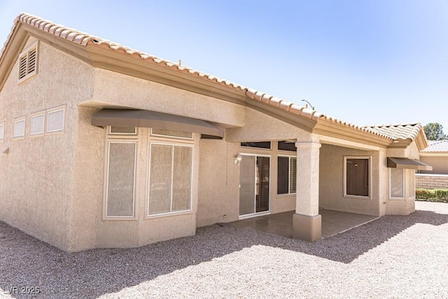 2501 Maddington Dr, Las Vegas, NV 89134 - back of house with stucco siding, a patio, and a tiled roof