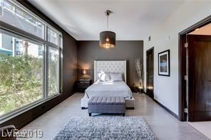 8925 W Flamingo Rd Unit 117, Las Vegas, NV 89147 - bedroom featuring baseboards
