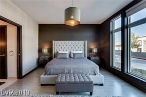 8925 W Flamingo Rd Unit 117, Las Vegas, NV 89147 - bedroom featuring an accent wall
