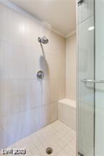 8925 W Flamingo Rd Unit 117, Las Vegas, NV 89147 - bathroom with a stall shower and crown molding