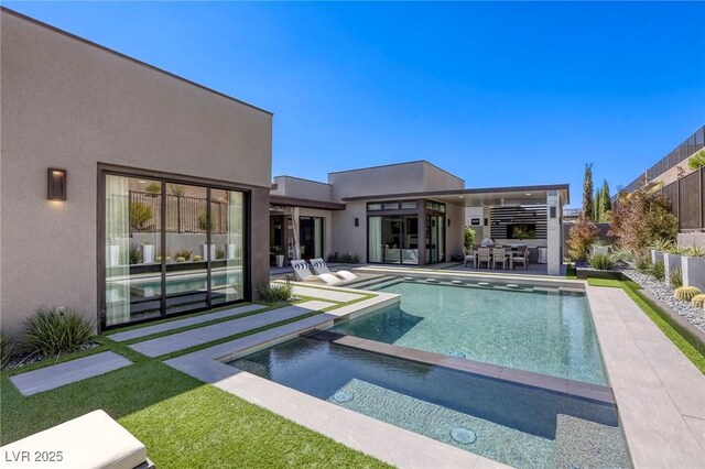 787 Keyland St, Las Vegas, NV 89138 - view of swimming pool with a fenced backyard, a patio area, and a pool with connected hot tub