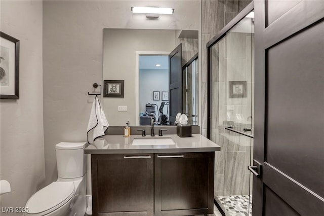 787 Keyland St, Las Vegas, NV 89138 - bathroom with a stall shower, toilet, and vanity