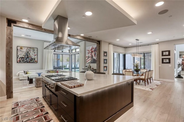 787 Keyland St, Las Vegas, NV 89138 - kitchen featuring stainless steel gas cooktop, baseboards, light wood-type flooring, recessed lighting, and island range hood
