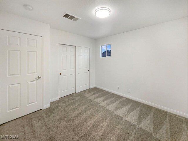 6120 Desert Haven Rd, Las Vegas, NV 89130 - unfurnished bedroom with carpet, baseboards, and a closet