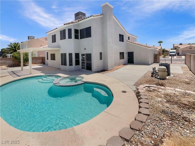 6120 Desert Haven Rd, Las Vegas, NV 89130 - view of swimming pool featuring a fenced backyard, a patio area, a pool with connected hot tub, and cooling unit