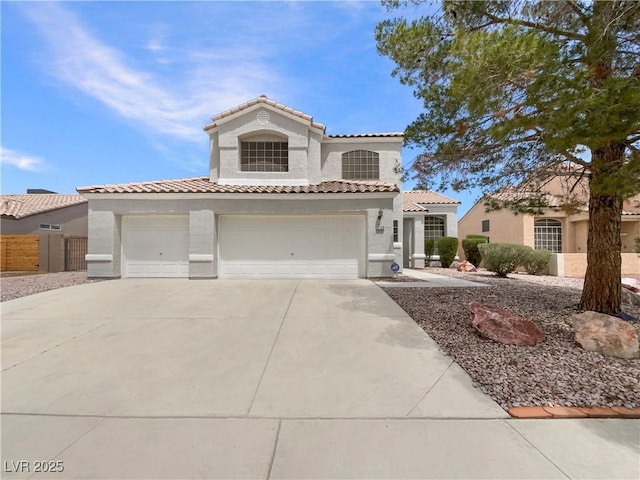 6120 Desert Haven Rd, Las Vegas, NV 89130 - mediterranean / spanish home featuring stucco siding, a tiled roof, concrete driveway, and a garage