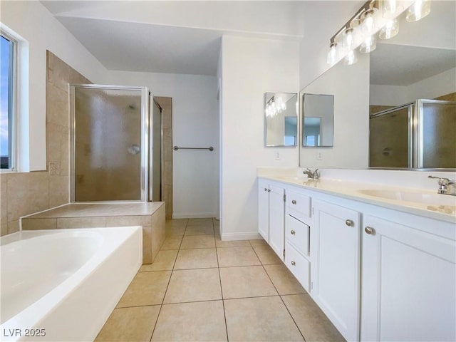 6120 Desert Haven Rd, Las Vegas, NV 89130 - bathroom with a shower stall, a bath, tile patterned flooring, double vanity, and baseboards