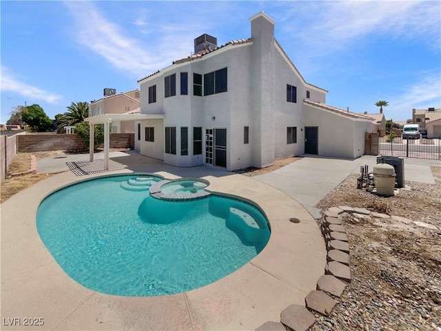 6120 Desert Haven Rd, Las Vegas, NV 89130 - view of pool with a patio area, a fenced backyard, a pool with connected hot tub, and central AC