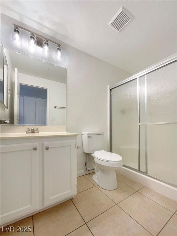 6120 Desert Haven Rd, Las Vegas, NV 89130 - bathroom featuring tile patterned flooring, a shower stall, vanity, and toilet