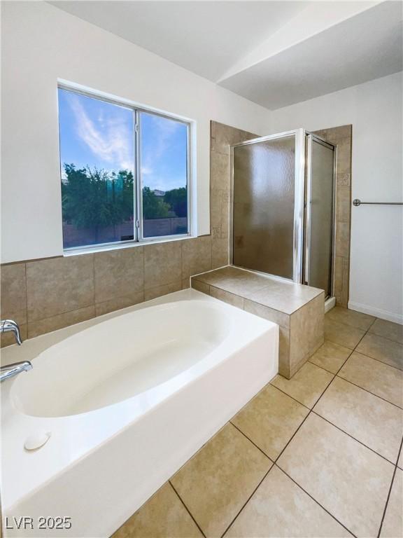 6120 Desert Haven Rd, Las Vegas, NV 89130 - bathroom with a stall shower, a bath, and tile patterned flooring