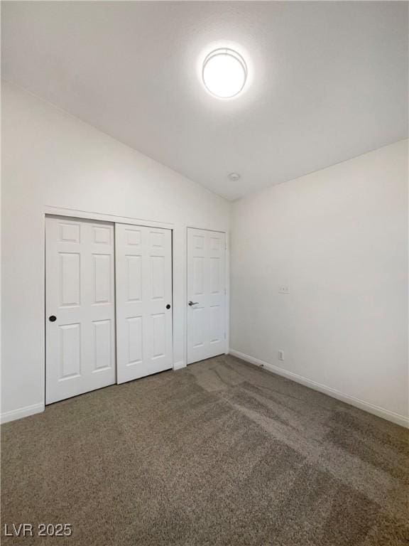 6120 Desert Haven Rd, Las Vegas, NV 89130 - unfurnished bedroom featuring vaulted ceiling, carpet, baseboards, and a closet
