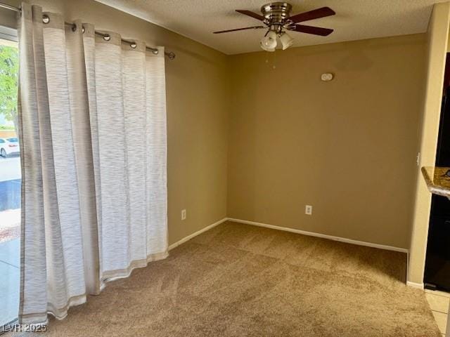 7912 Foxwood Pl Unit 104, Las Vegas, NV 89145 - unfurnished bedroom featuring carpet floors, a textured ceiling, baseboards, and a ceiling fan