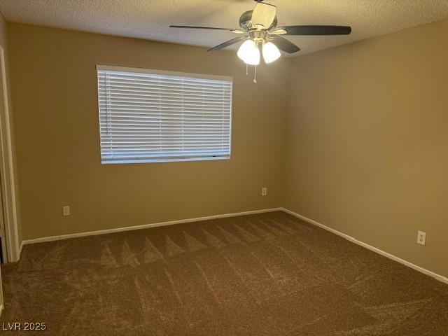 7912 Foxwood Pl Unit 104, Las Vegas, NV 89145 - carpeted empty room featuring a ceiling fan, baseboards, and a textured ceiling