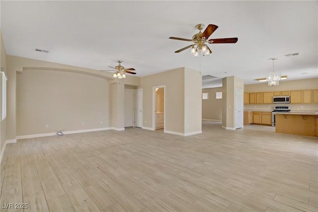 8913 Loggers Mill Ave, Las Vegas, NV 89143 - unfurnished living room featuring ceiling fan, light wood-style floors, baseboards, and a chandelier