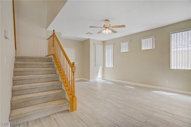 8913 Loggers Mill Ave, Las Vegas, NV 89143 - staircase with ceiling fan, baseboards, and wood finished floors
