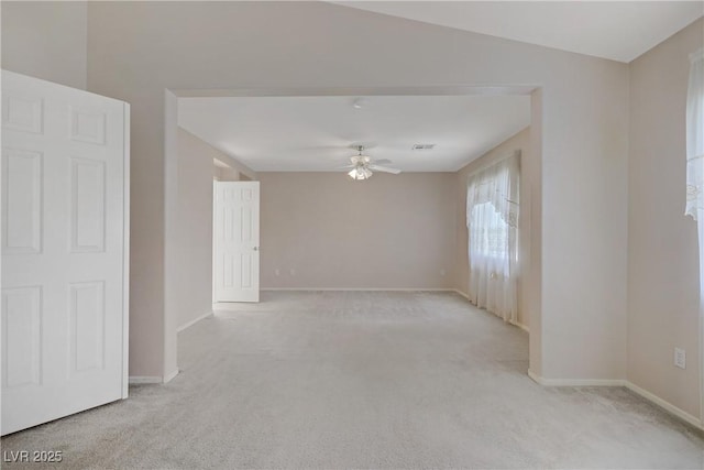 8913 Loggers Mill Ave, Las Vegas, NV 89143 - spare room featuring a ceiling fan, light carpet, and baseboards