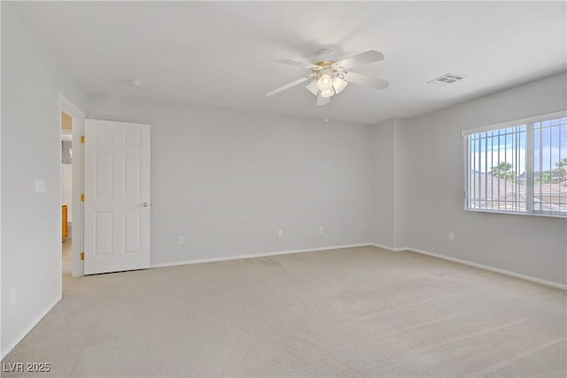 8913 Loggers Mill Ave, Las Vegas, NV 89143 - empty room featuring light carpet, a ceiling fan, and baseboards