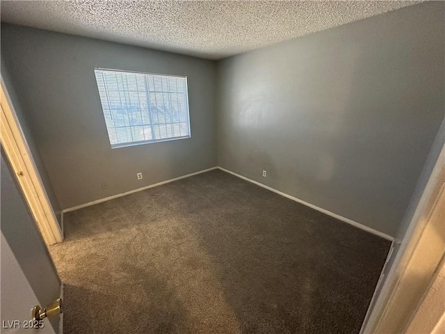 227 N Lamb Blvd Unit A, Las Vegas, NV 89110 - spare room featuring dark colored carpet, a textured ceiling, and baseboards