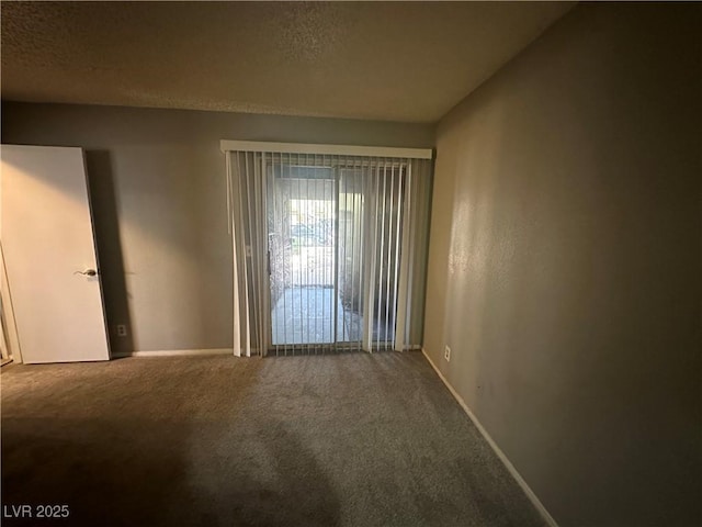 227 N Lamb Blvd Unit A, Las Vegas, NV 89110 - carpeted empty room with baseboards and a textured ceiling