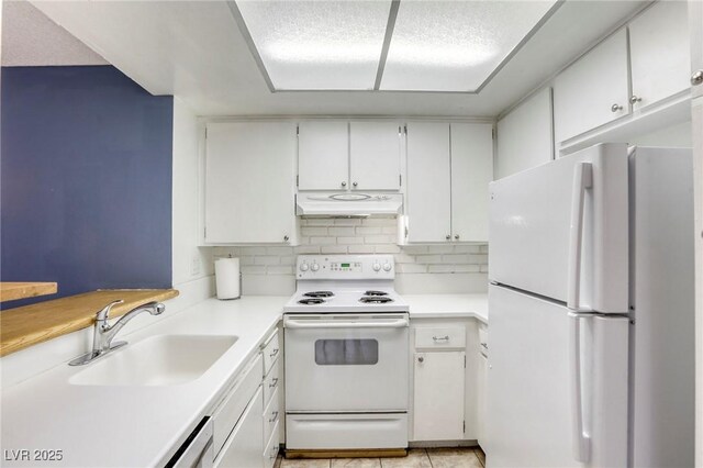 2349 Wooster Cir Unit A, Las Vegas, NV 89108 - kitchen with white appliances, under cabinet range hood, a sink, and white cabinets
