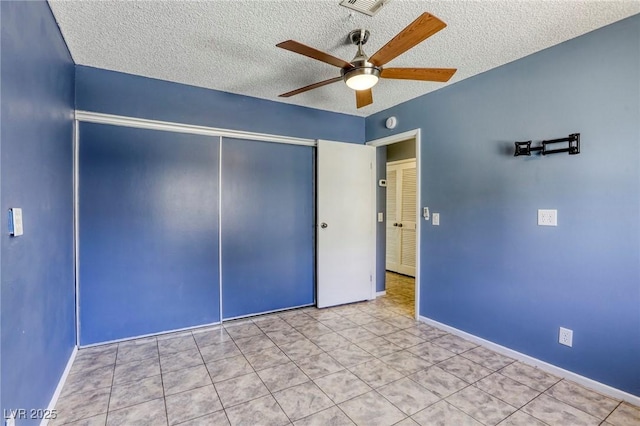 2349 Wooster Cir Unit A, Las Vegas, NV 89108 - spare room featuring a ceiling fan, a textured ceiling, tile patterned flooring, and baseboards