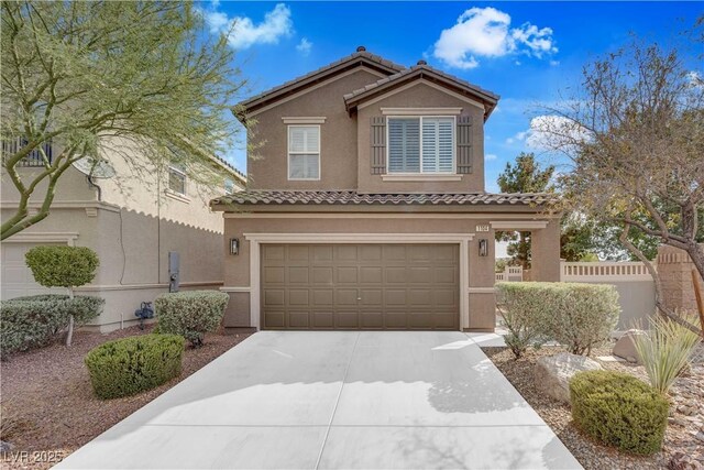 1104 Aspen Cliff Dr, Henderson, NV 89011 - mediterranean / spanish house featuring stucco siding, a garage, a tiled roof, and driveway