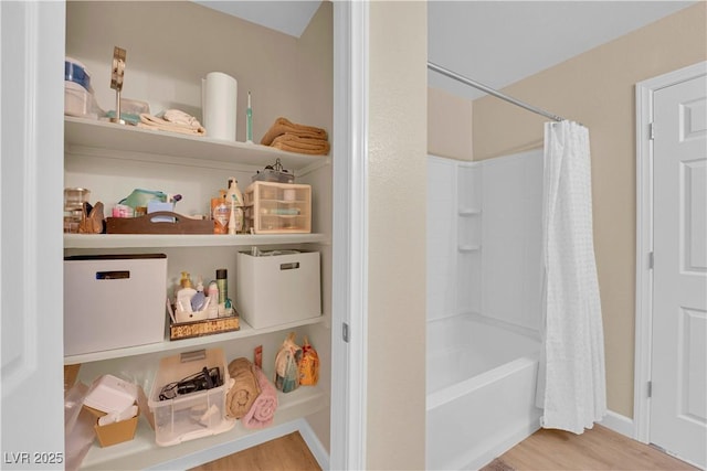1104 Aspen Cliff Dr, Henderson, NV 89011 - full bathroom with wood finished floors and shower / bath combination with curtain