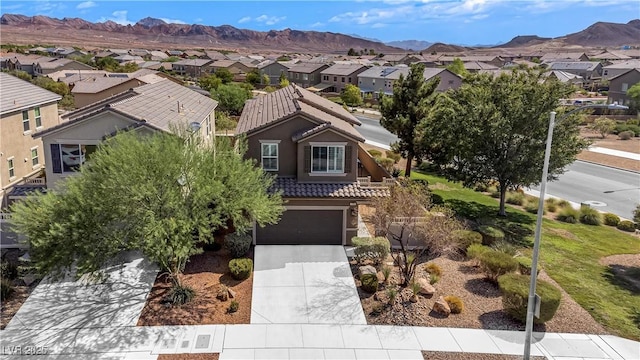 1104 Aspen Cliff Dr, Henderson, NV 89011 - view of front facade featuring a residential view, a tile roof, concrete driveway, and an attached garage