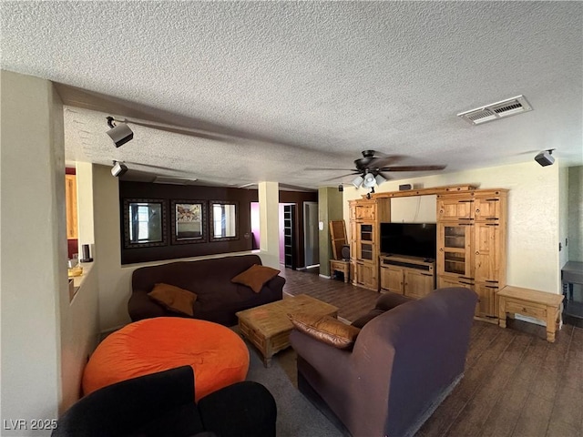 8237 Cline Mountain St, Las Vegas, NV 89131 - living area with dark wood finished floors, a ceiling fan, a textured ceiling, and baseboards