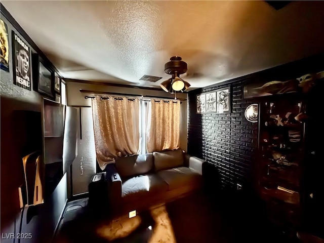 8237 Cline Mountain St, Las Vegas, NV 89131 - cinema room featuring a ceiling fan and a textured ceiling
