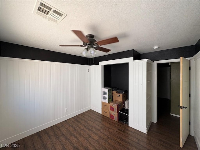 8237 Cline Mountain St, Las Vegas, NV 89131 - unfurnished bedroom with wood finished floors, baseboards, a textured ceiling, and a ceiling fan