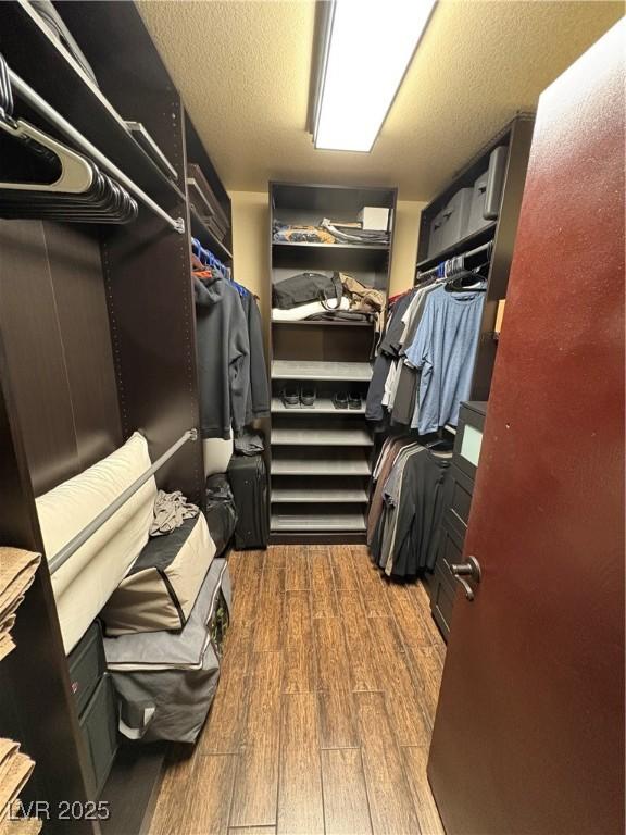 8237 Cline Mountain St, Las Vegas, NV 89131 - walk in closet featuring wood finished floors