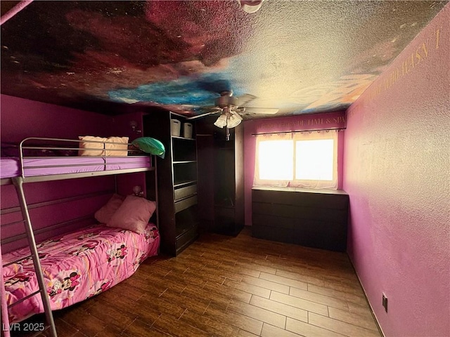 8237 Cline Mountain St, Las Vegas, NV 89131 - bedroom with a textured wall, wood finished floors, a textured ceiling, and ceiling fan