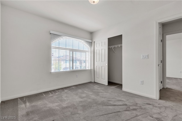 5661 Brimstone Hill Ave, Las Vegas, NV 89141 - unfurnished bedroom featuring carpet, a closet, and baseboards