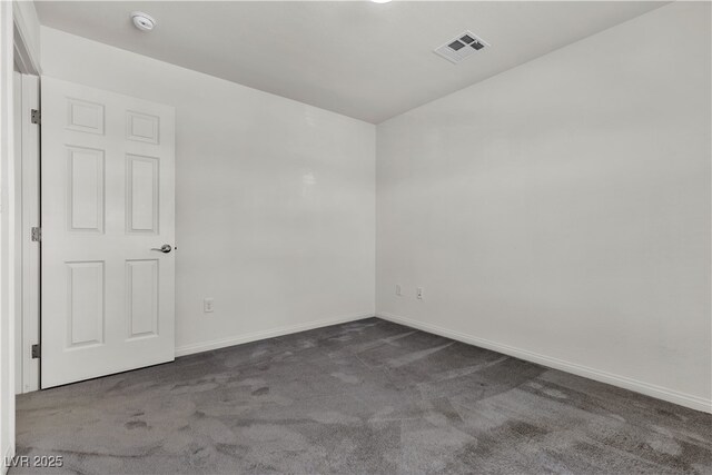 5661 Brimstone Hill Ave, Las Vegas, NV 89141 - spare room with dark colored carpet, a smoke detector, and baseboards