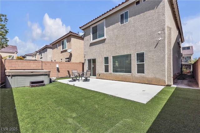 5661 Brimstone Hill Ave, Las Vegas, NV 89141 - rear view of property with stucco siding, a hot tub, a patio area, and a tiled roof