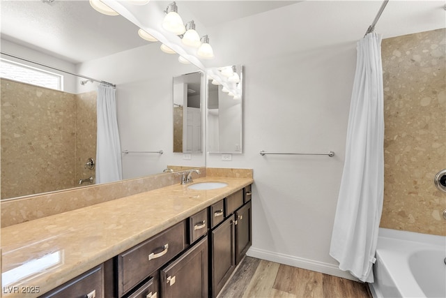 5661 Brimstone Hill Ave, Las Vegas, NV 89141 - bathroom with shower / bath combo with shower curtain, wood finished floors, vanity, and baseboards