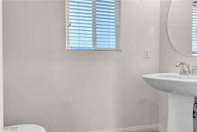 5661 Brimstone Hill Ave, Las Vegas, NV 89141 - half bathroom featuring a sink and toilet