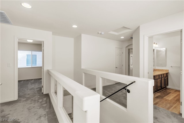 5661 Brimstone Hill Ave, Las Vegas, NV 89141 - hallway with baseboards, recessed lighting, and light carpet