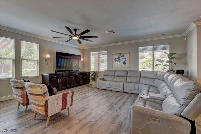 5635 Mesa Mountain Dr, Las Vegas, NV 89135 - living area featuring light wood finished floors, healthy amount of natural light, a ceiling fan, crown molding, and baseboards